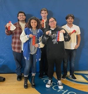 Perry High School Academic Decathlon students pose for a photo during the regional competition at Central Campus in Des Moines. Front row, Amy Aguirre-Eugenio and Ashley Robles. Back row, Jefry Gonzalez, Seth Borgeson and Jose Chavez.