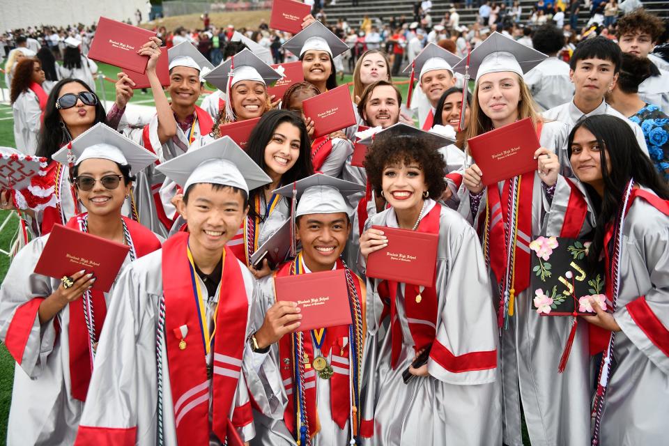 Vineland High School seniors celebrate following the commencement ceremony at Gittone Stadium on Wednesday, June 22, 2022.