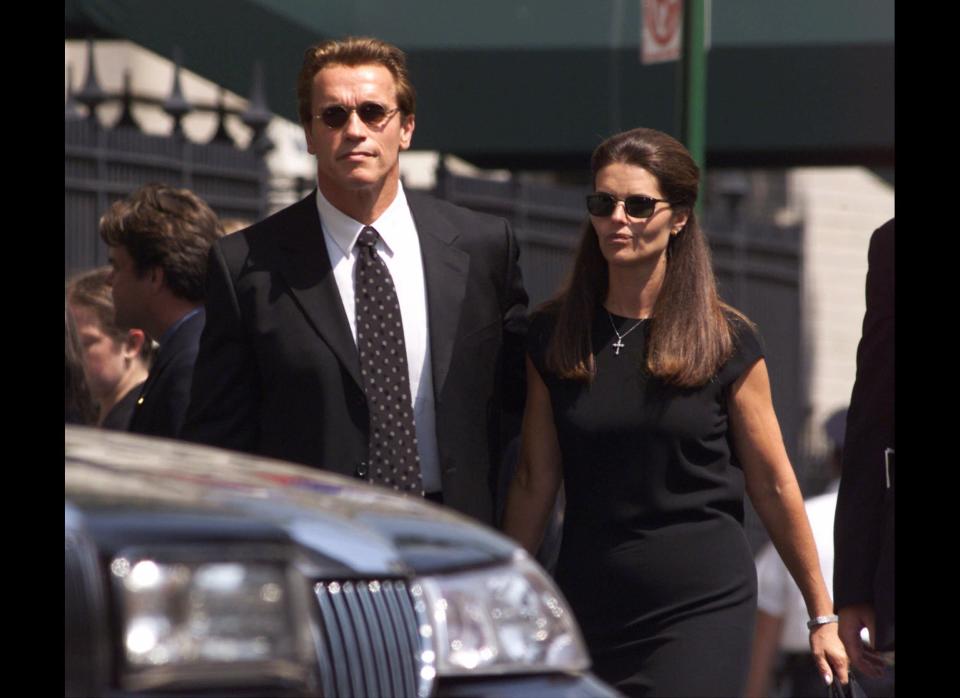 Arnold Schwarzenegger and Maria Shriver leave a reception at the Sacred Heart Convent School following a memorial Mass for John F. Kennedy Jr. and Carolyn Bessette Kennedy in New York Friday, July 23, 1999. (AP Photo/Suzanne Plunkett/July 23, 1999)