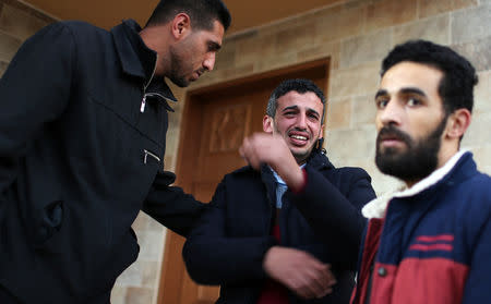 A relative of Palestinian teen Hassan Shalabi reacts as his body is brought into a hospital in the southern Gaza Strip February 8, 2019. REUTERS/Ibraheem Abu Mustafa