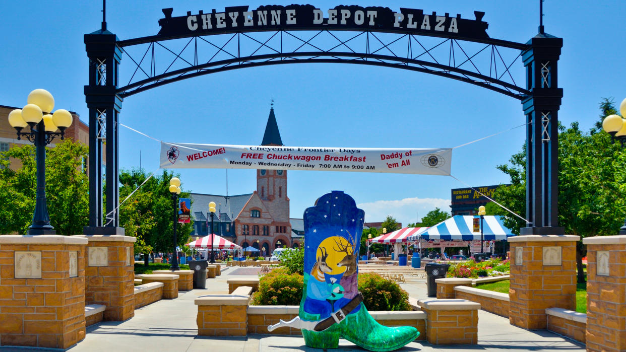 Cheyenne, Wyoming, USA - July 21, 2013: People near the entrance to the Cheyenne Depot Plaza, city park in downtown Cheyenne.