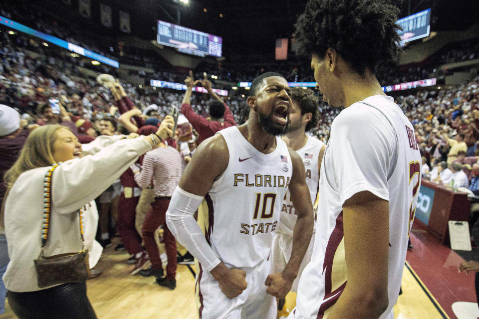 Florida State forward Malik Osborne (10) and forward John Butler (22) celebrate beating Duke 79-78 in overtime of an NCAA college basketball game in Tallahassee, Fla., Tuesday Jan. 18, 2022. (AP Photo/Mark Wallheiser)