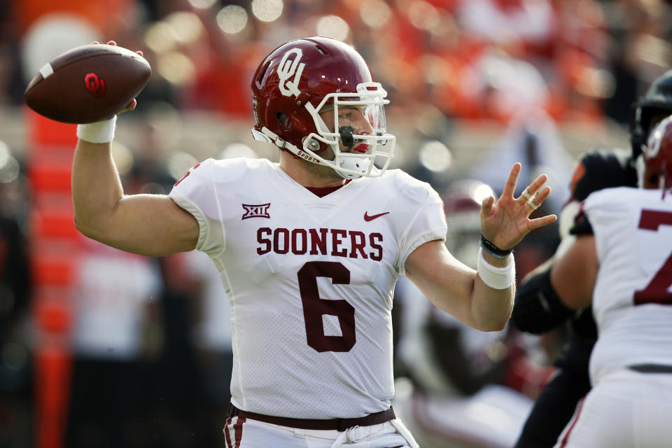 FILE - Oklahoma quarterback Baker Mayfield (6) looks to throw in the first half of an NCAA college football game against Oklahoma State in Stillwater, Okla., Nov. 4, 2017. Oklahoma and Oklahoma State will meet on Saturday for the final time before Oklahoma leaves the Big 12 for the Southeastern Conference. (AP Photo/Sue Ogrocki, File)