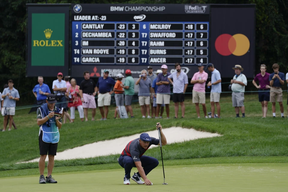 Bryson DeChambeau lines up his putt on the fourth green during the final round of the BMW Championship golf tournament, Sunday, Aug. 29, 2021, at Caves Valley Golf Club in Owings Mills, Md. (AP Photo/Julio Cortez)