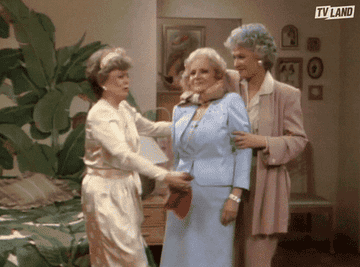 The women of "Golden Girls" embracing in a group hug