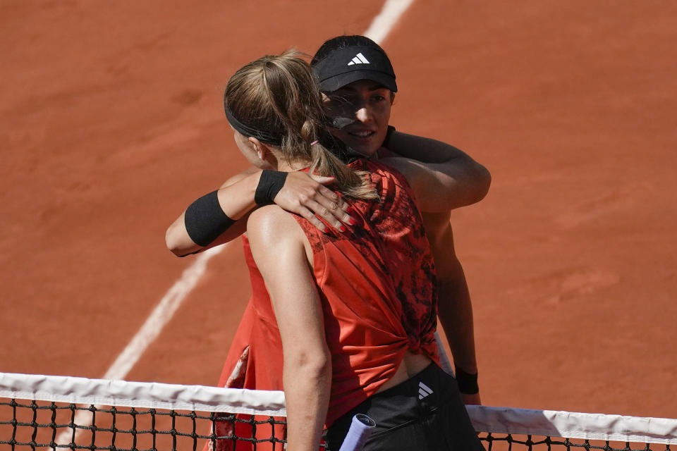 Karolina Muchova of the Czech Republic, left, and Russia's Elina Avanesyan hug each other after their fourth round match of the French Open tennis tournament at the Roland Garros stadium in Paris, Sunday, June 4, 2023. (AP Photo/Christophe Ena)