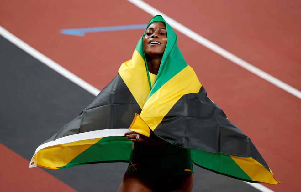 Tokyo 2020 Olympics - Athletics - Women's 100m - Final - OLS - Olympic Stadium, Tokyo, Japan - July 31, 2021. Gold medallist Elaine Thompson-Herah of Jamaica celebrates after winning REUTERS/Phil Noble     TPX IMAGES OF THE DAY