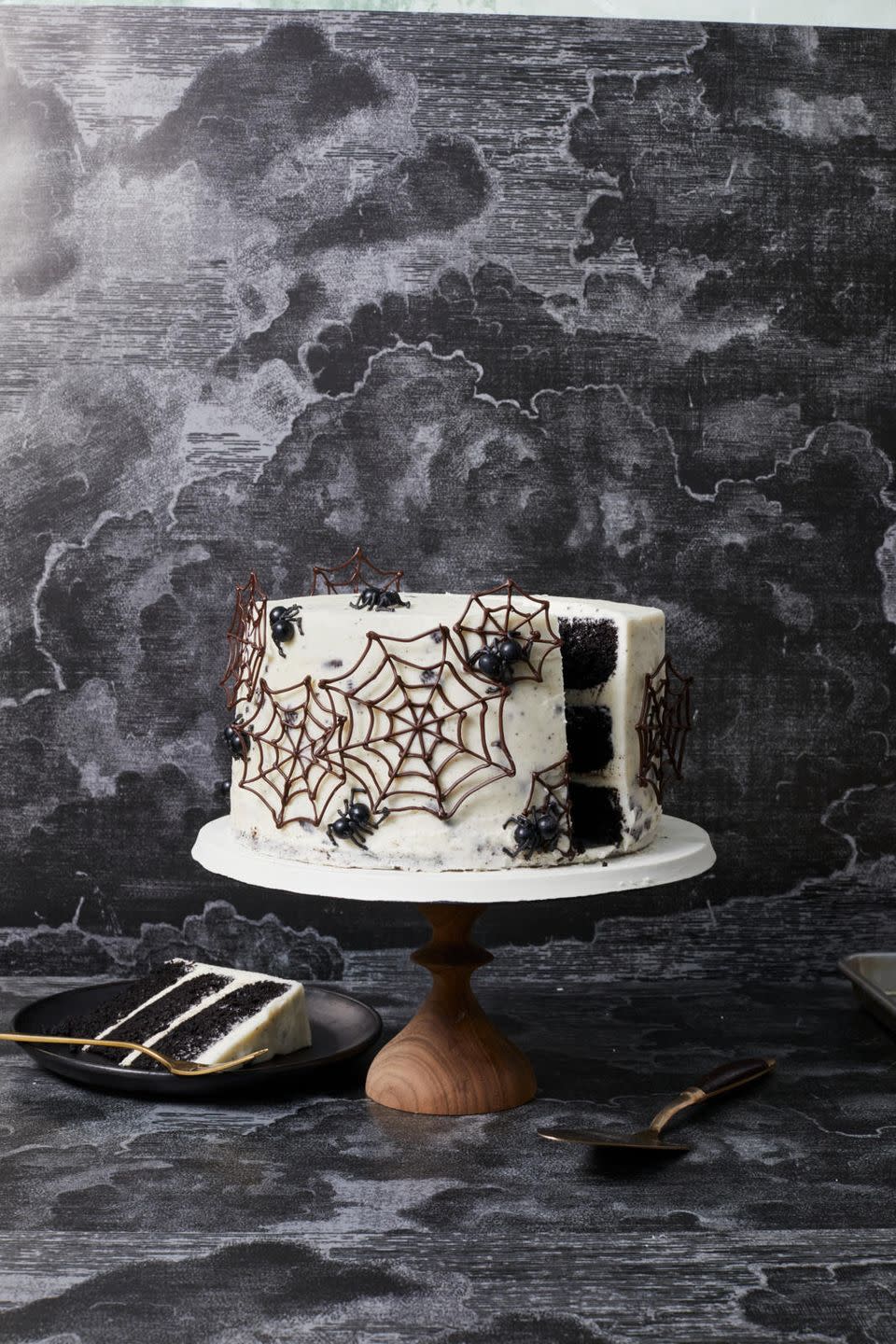 <p>If you dare … try black cocoa powder for this spooky surprise-inside sweet with a crushed Oreo cookie frosting.</p><p>Get the <strong><a href="https://www.goodhousekeeping.com/food-recipes/dessert/a33461174/spider-web-cake-recipe/" rel="nofollow noopener" target="_blank" data-ylk="slk:Spider Web Cake recipe;elm:context_link;itc:0;sec:content-canvas" class="link ">Spider Web Cake recipe</a></strong><em>.</em></p>