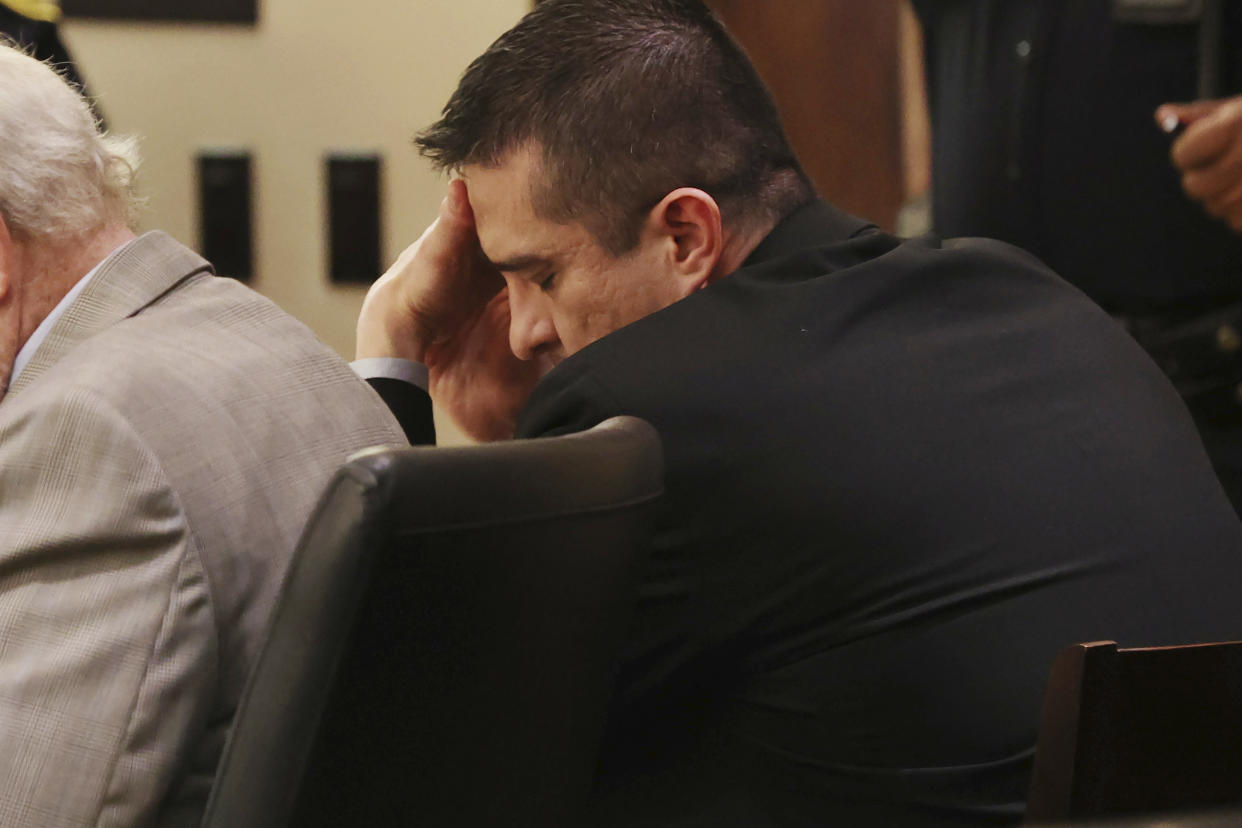 Former U.S. Border Patrol supervisor Juan David Ortiz reacts as recorder jail phone calls to his wife, Daniella, are played outside the presence of the jury during his capital murder trial at the Cadena-Reeves Justice Center in San Antonio, Texas, Tuesday, Dec. 6, 2022. (Jerry Lara/The San Antonio Express-News via AP)