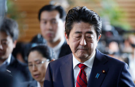 Japan's Prime Minister Shinzo Abe walks after speaking on reports of the launch of a North Korean missile to reporters , at his official residence in Tokyo, Japan May 29, 2017. REUTERS/Toru Hanai