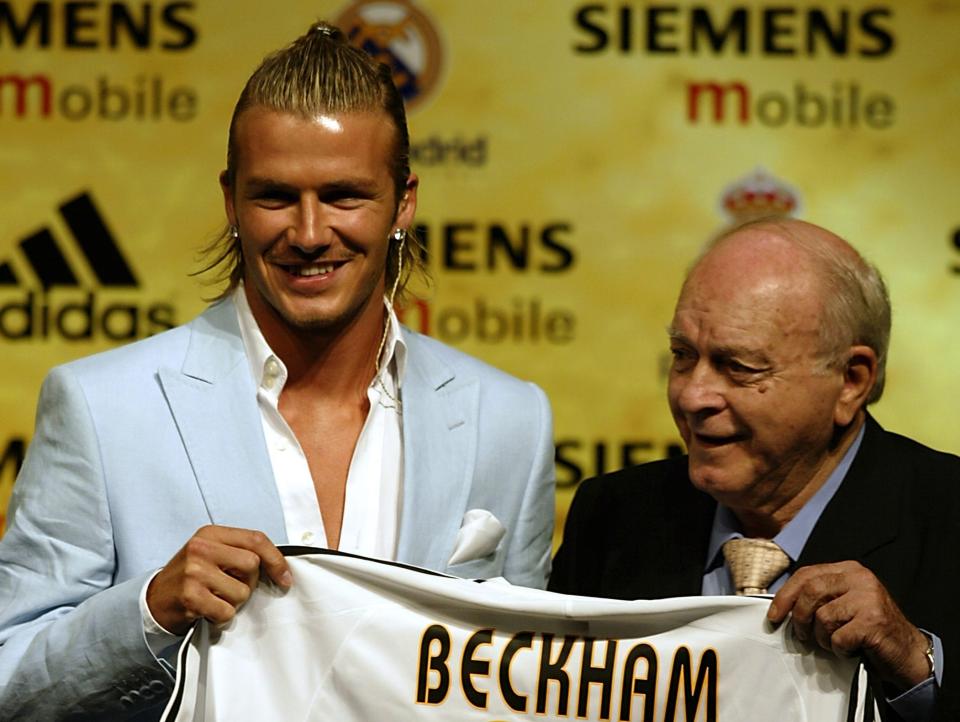 David Beckham is given his new shirt and number by Alfredo Di Stefano.