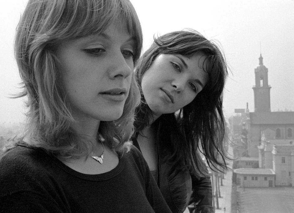 Heart, (L-R) Musician Nancy Wilson and singer Ann Wilson pose on Hollywood, CA rooftop, September 1976 (Photo by Mark Sullivan/Getty Images)