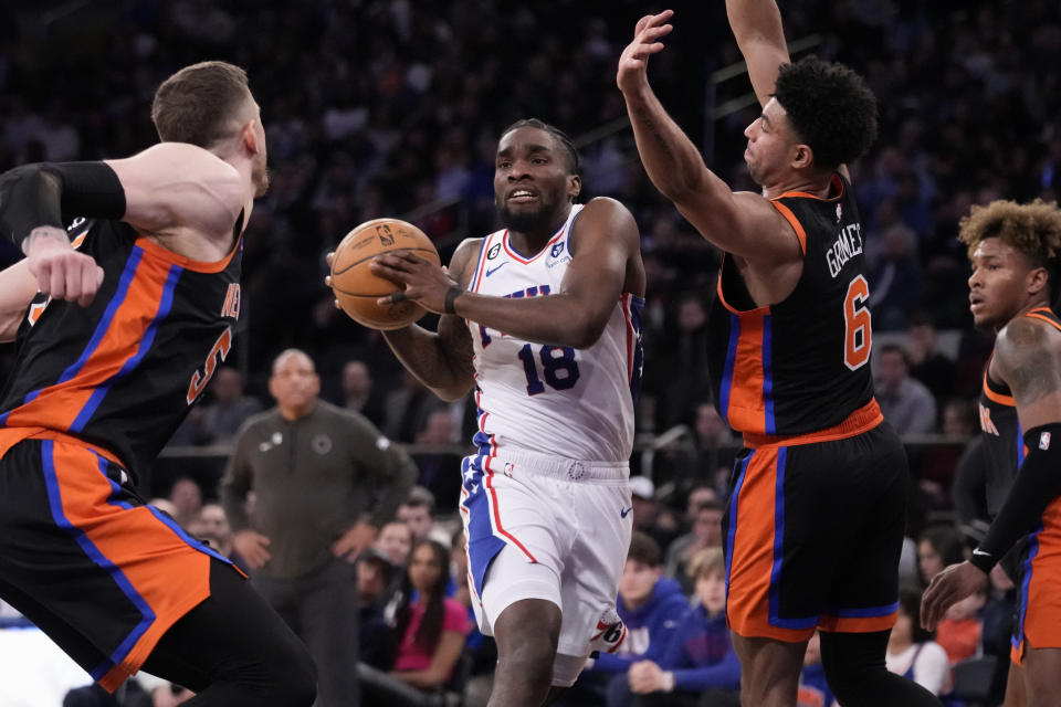 Philadelphia 76ers guard Shake Milton (18) drives against New York Knicks guard Quentin Grimes (6) during the first half of an NBA basketball game, Sunday, Feb. 5, 2023, in New York. (AP Photo/John Minchillo)