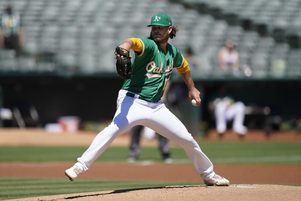 Oakland Athletics' Cole Irvin pitches against the Miami Marlins during the first inning of a baseball game in Oakland, Calif., Wednesday, Aug. 24, 2022. (AP Photo/Jeff Chiu)