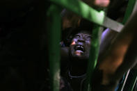 <p>A woman is crushed in a crowd of people waiting for food rations in the aftermath of the Jan. 12 earthquake in Port-au-Prince, Thursday, Jan. 28, 2010. (Photo: Ramon Espinosa/AP) </p>