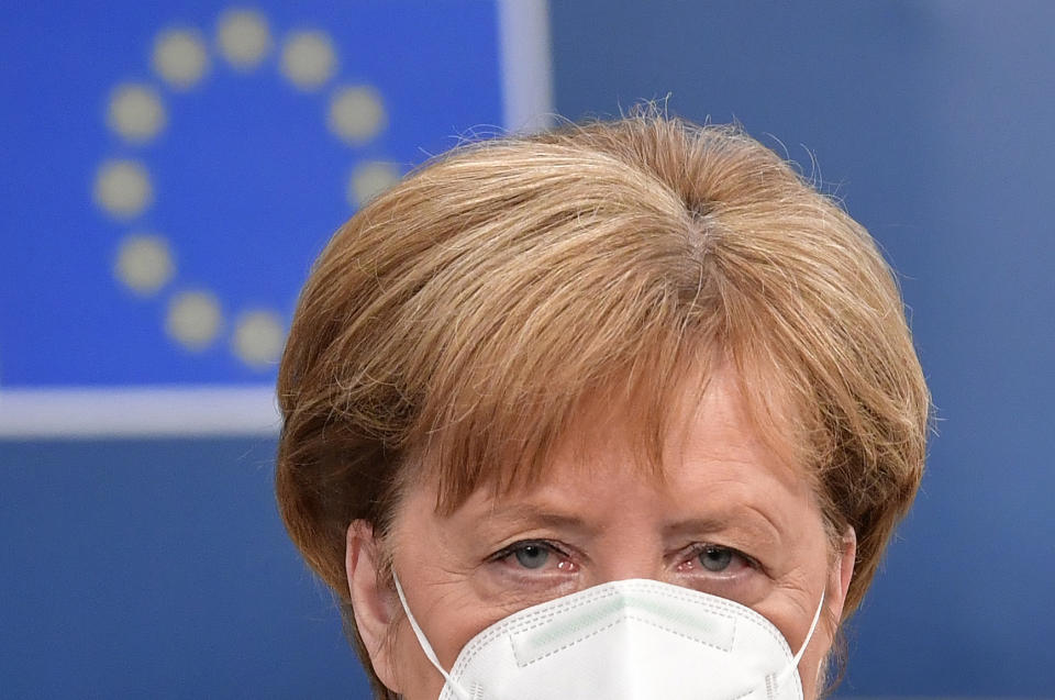 German Chancellor Angela Merkel arrives for an EU summit at the European Council building in Brussels, Sunday, July 19, 2020. Leaders from 27 European Union nations meet face-to-face for a third day to assess an overall budget and recovery package spread over seven years estimated at some 1.75 trillion to 1.85 trillion euros. (John Thys, Pool Photo via AP)