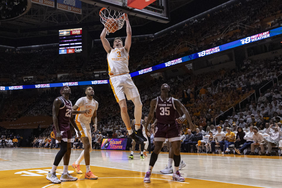 Tennessee guard Dalton Knecht (3) dunks past Texas A&M guard Manny Obaseki (35) during the second half of an NCAA college basketball game Saturday, Feb. 24, 2024, in Knoxville, Tenn. (AP Photo/Wade Payne)