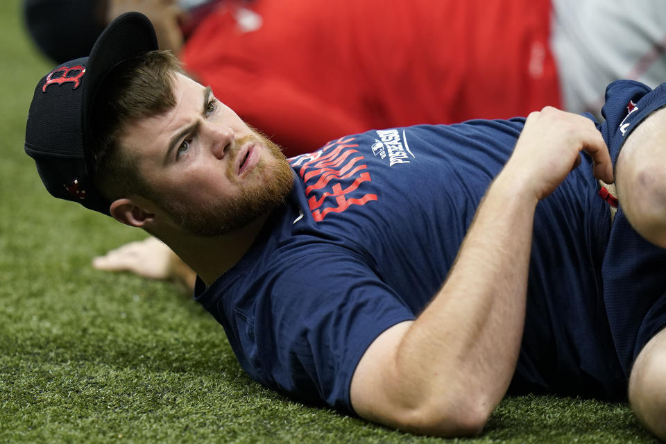 Boston Red Sox second baseman Christian Arroyo stretches during the baseball team's practice Wednesday, Oct. 6, 2021, in St. Petersburg, Fla., for an AL Division Series matchup against the Tampa Bay Rays that starts Thursday. (AP Photo/Chris O'Meara)