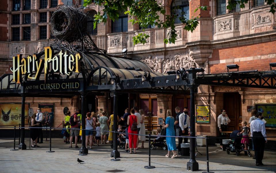 Theatre goers queue for a performance of Harry Potter and the Cursed Child at Palace Theatre on July 21, 2021 in London, England. Several UK theatre productions have either closed or been unable to premiere due to cast members having to isolate after being "pinged" by the NHS test and trace app. Composer Andrew Lloyd Webber has postponed the opening of Cinderella in the West End saying that the government's isolation policy is a "blunt instrument" after there was a covid case amongst the cast. - Getty Images