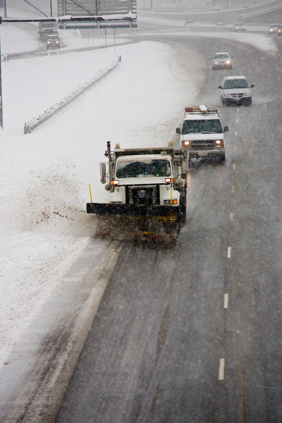 Ohio Department of Transportation snowplows clear the way.