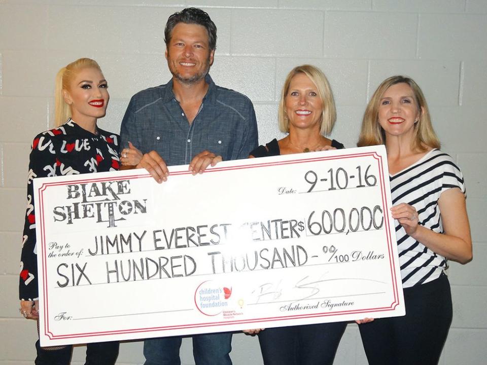 Blake Shelton posed with Gwen Stefani while making a $600,000 donation to the Jimmy Everest Center