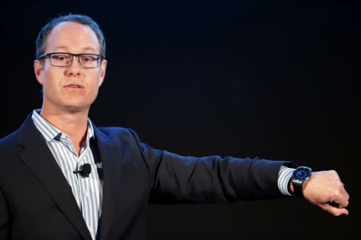 Qualcomm President Derek Aberle shows a watch made with a Qualcomm snapdragon processor during a press conference March 2, 2015. (Reuters/Albert Gea)