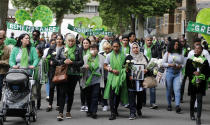 People march to mark the two-year anniversary of the Grenfell Tower block fire in London, Friday, June 14, 2019. Survivors, neighbors and politicians including London Mayor Sadiq Khan attended a church service of remembrance on Friday for the Grenfell Tower blaze, the deadliest fire on British soil since World War II. (AP Photo/Frank Augstein)