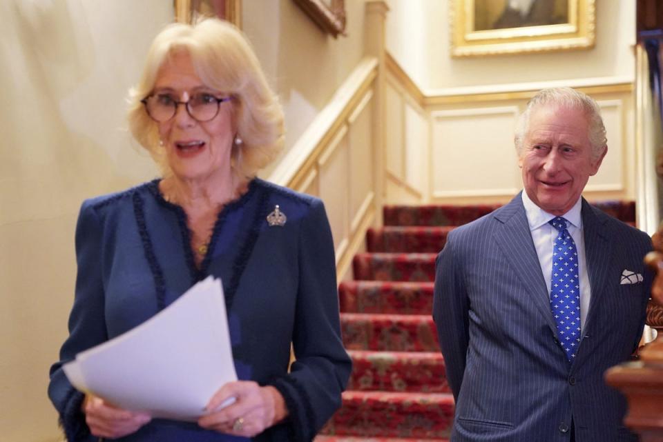 The Queen Consort, joined by King Charles III, hosts a reception at Clarence House on the anniversary of the Reading Room (Reuters)