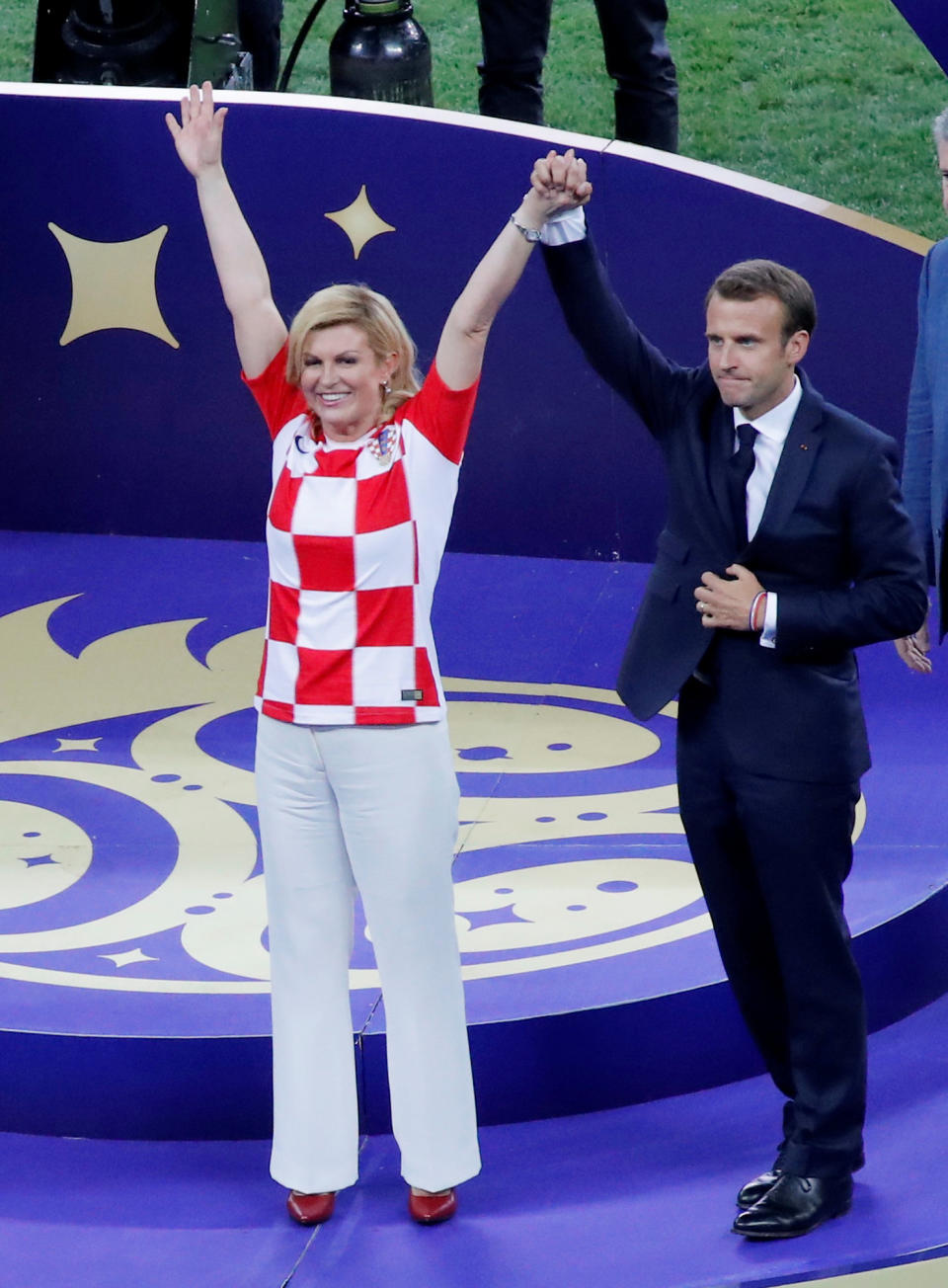 Soccer Football – World Cup – Final – France v Croatia – Luzhniki Stadium, Moscow, Russia – July 15, 2018 President of Croatia Kolinda Grabar-Kitarovic and President of France Emmanuel Macron before the trophy presentation REUTERS/Maxim Shemetov