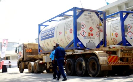 FILE PHOTO: Tanker trucks that used to haul oil products, ferry the crude oil during a pilot scheme to export crude oil, as they arrive at the Kenya Pipeline Company in the port city of Mombasa