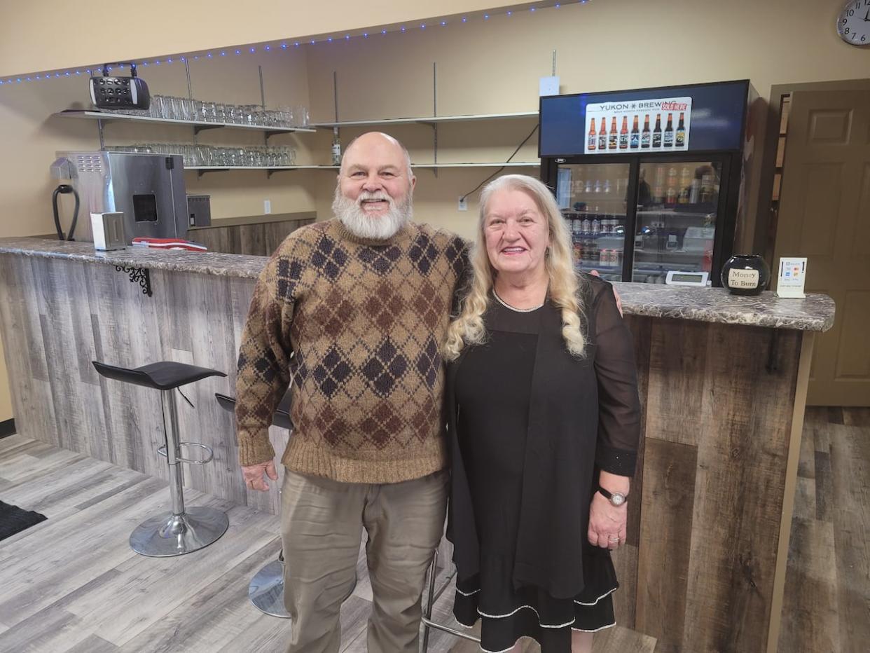 Phyllis Villaver inside her new restaurant and lounge, with Faro's Mayor Jack Bowers.  (Larry Baran/ Town of Faro - image credit)