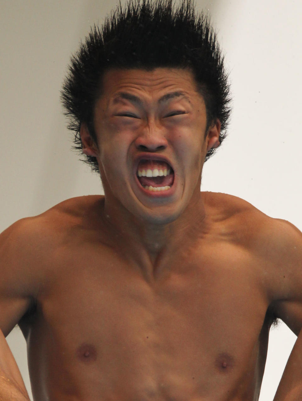 "How come I never get to go first?" Sho Sakai of Japan competes in the Men's 3m Springboard preliminary round during Day Six of the 14th FINA World Championships at the Oriental Sports Center on July 21, 2011 in Shanghai, China. (Photo by Ezra Shaw/Getty Images)