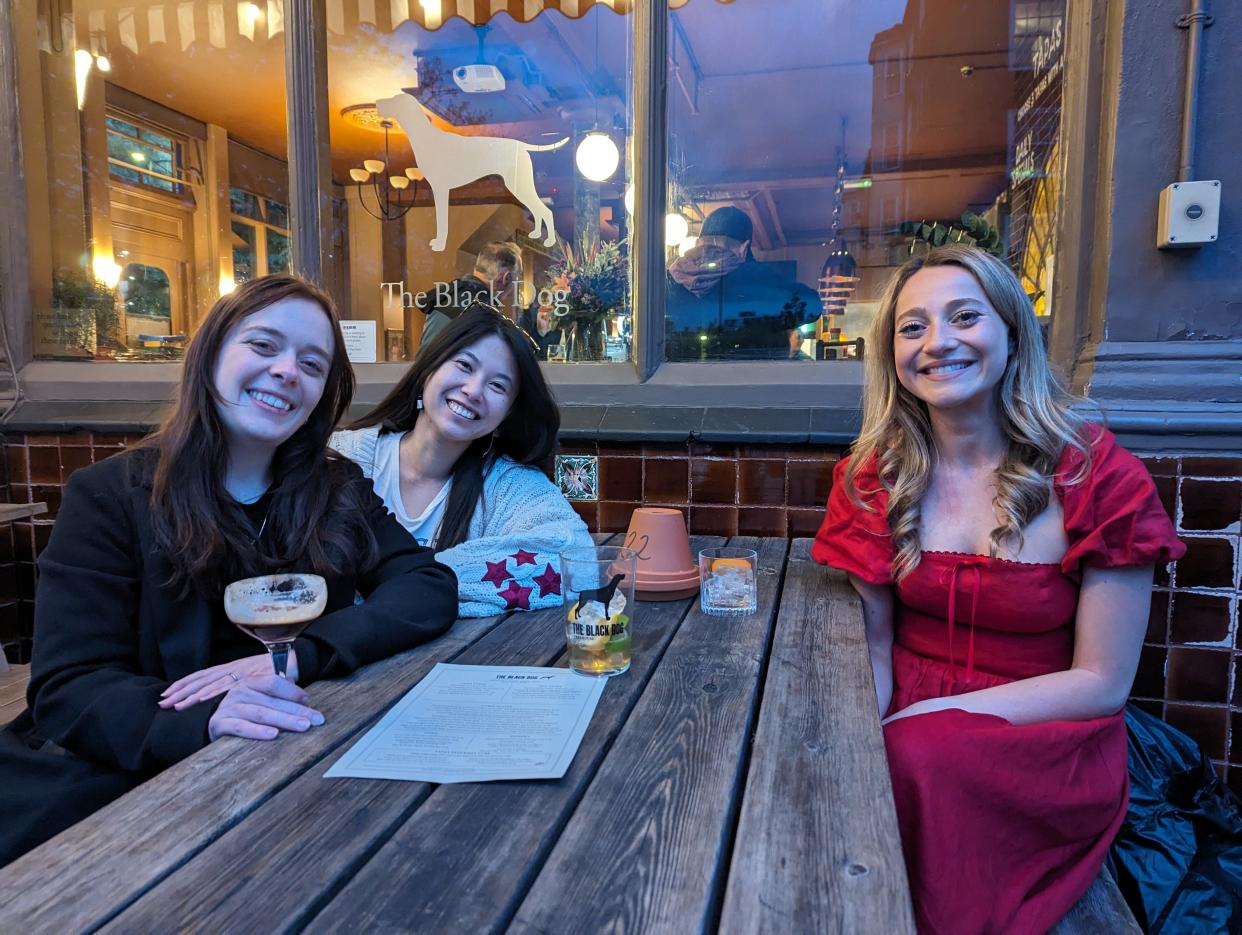 Photo of three Swifties outside The Black Dog pub.