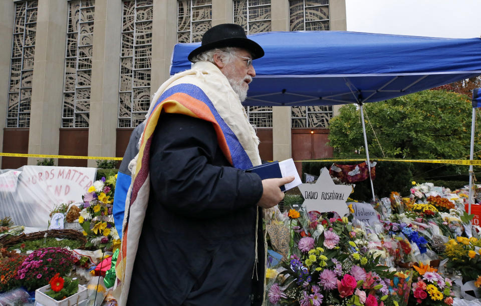 Former Rabbi at Tree of Life Synagogue, Rabbi Chuck Diamond, prepares to lead a Shabbat morning service Saturday, Nov. 3, 2018 in Pittsburgh. About 100 people gathered in a cold drizzle for what was called a "healing service" outside the synagogue that was the scene of a mass shooting a week ago. (AP Photo/Gene J. Puskar)