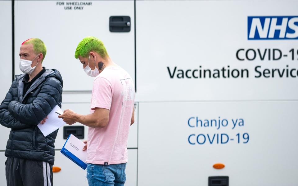 People outside a vaccination centre in Bolton on 23 June 2021 - James Speakman/Mercury Press