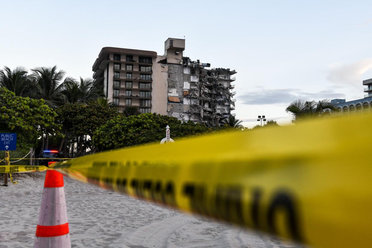 Police tape blocks access to a partially collapsed building in Surfside north of Miami Beach, on June 24, 2021. A multi-story apartment block in Florida partially collapsed during early June 24, sparking a major emergency response.