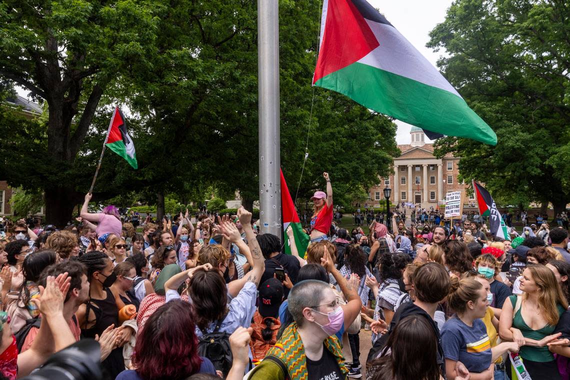 Pro-Palestinian demonstrators replace an American flag with a Palestinian flag Tuesday, April 30, 2024 at UNC-Chapel Hill. Police removed a “Gaza solidarity encampment” earlier Tuesday morning.