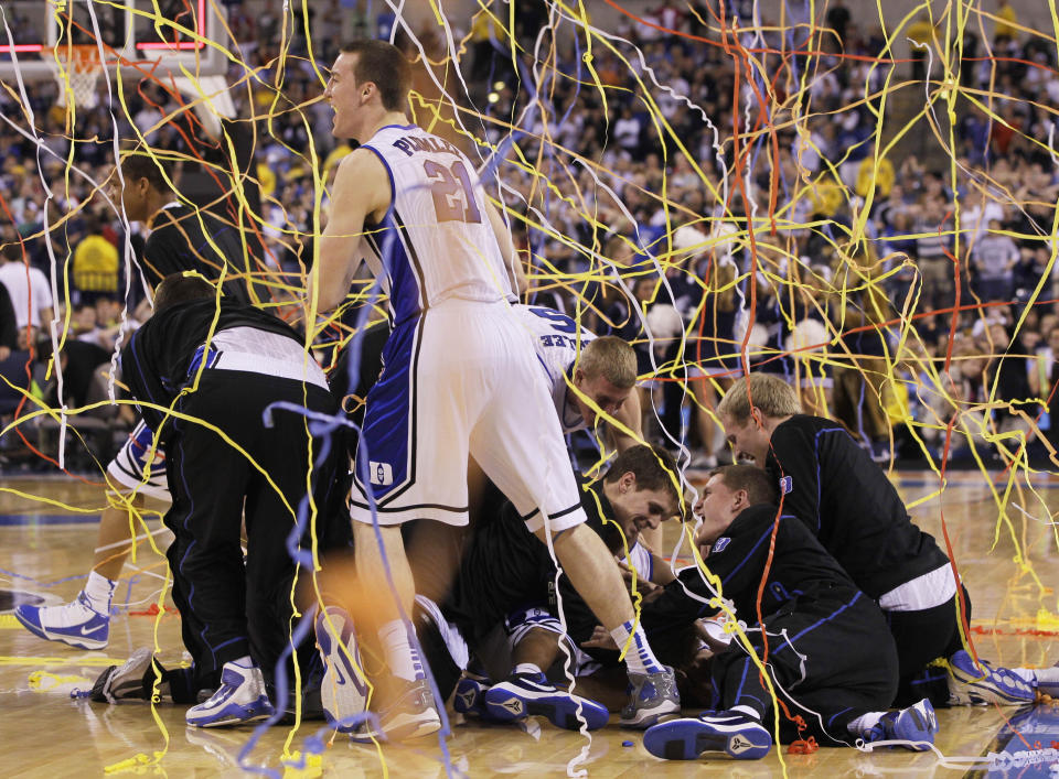 FILE - In this April 5, 2010, file photo, Duke's Miles Plumlee (21) and teammates celebrate after Duke's 61-59 win over Butler in the men's NCAA Final Four college basketball championship game in Indianapolis. (AP Photo/Charlie Neibergall, File)