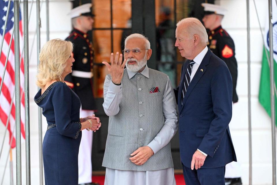 US President Joe Biden (R) and First Lady Jill Biden (L) greet India’s Prime Minister Narendra Modi as he arrives at the South Portico of the White House (AFP via Getty Images)