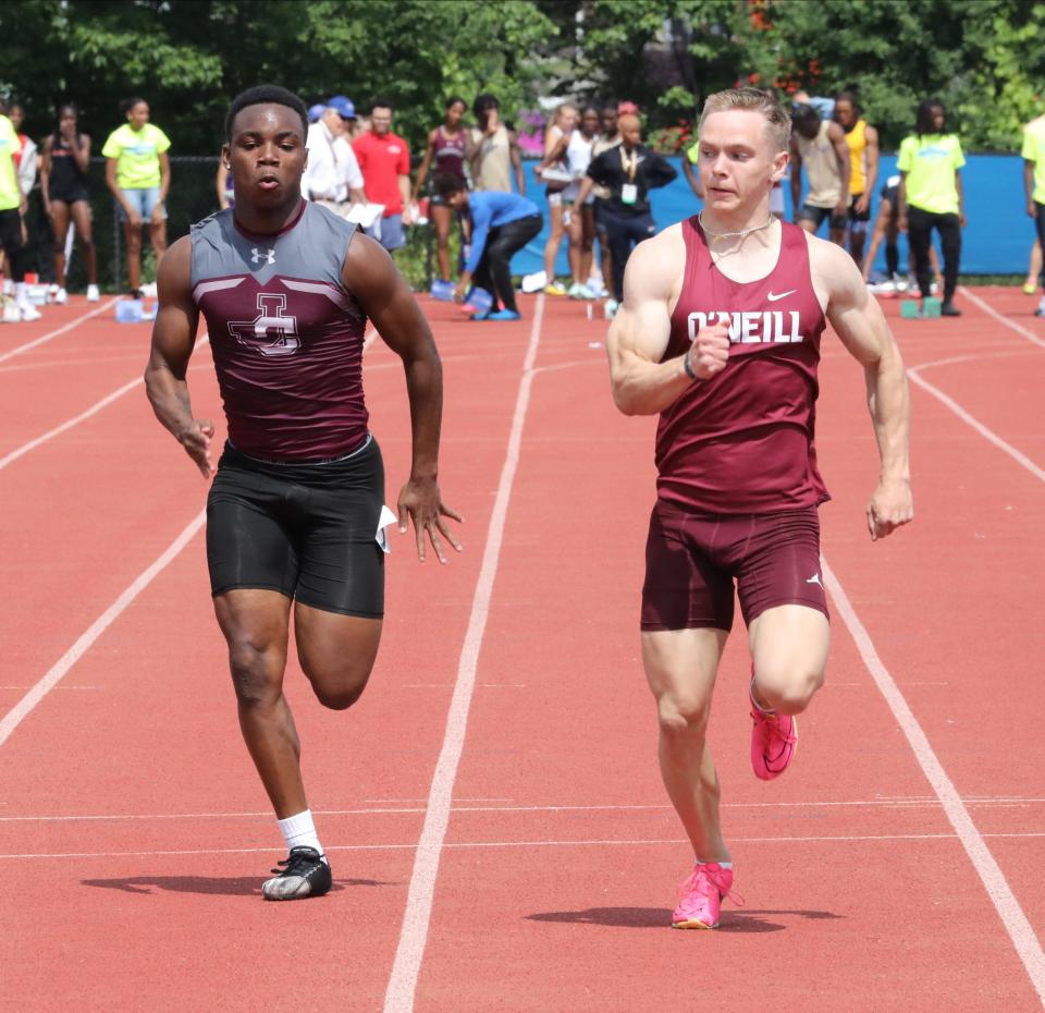 Dayzin Legare from Johnson City and Jadon Spain from James O'Neill compete in the boys 100 meter dash division 2, during the New York State Track and Field Championships at Middletown High School, June 10, 2023.