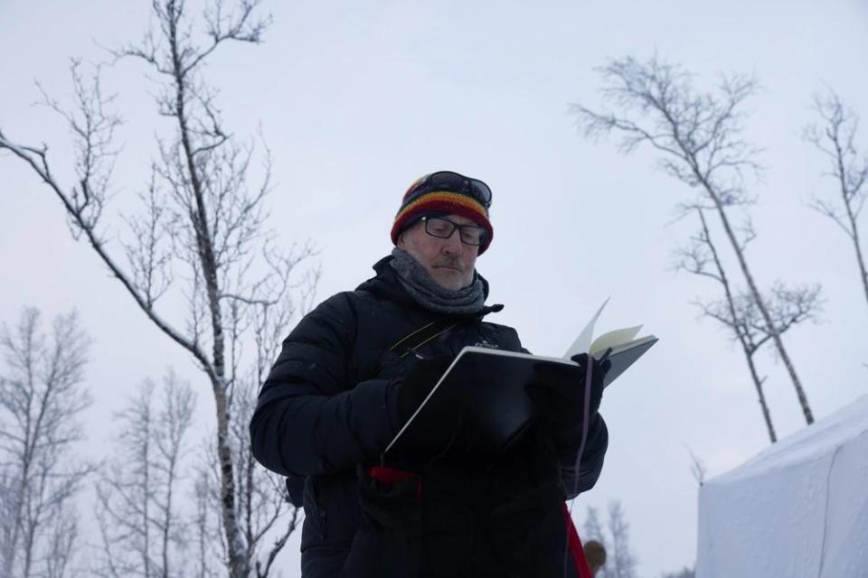 Richard Johnson, a combat artist with the Marine Corps Combat Art Program, illustrates Marines in a sketchbook during cold weather training.