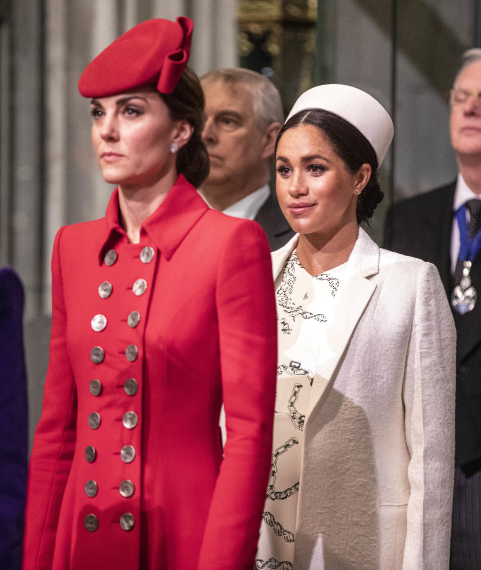  Catherine, The Duchess of Cambridge stands with Meghan, Duchess of Sussex at Westminster Abbey for a Commonwealth day service 