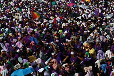 Supporters attend a rally to support the adoption of a strict Islamic penal code at Padang Merbok in Kuala Lumpur, Malaysia, February 18, 2017. REUTERS/Athit Perawongmetha