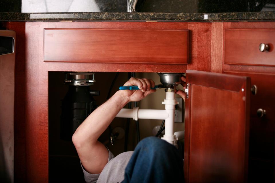 Professional Plumber Installing a Kitchen Sink