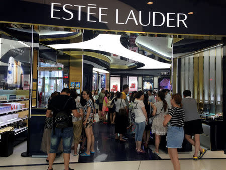 Chinese shoppers crowd a luxury store inside a mall in Sanya on Hainan Island, China May 11, 2016. REUTERS/Farah Master