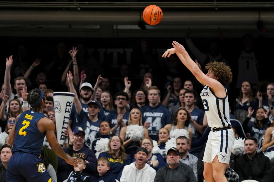 Butler Bulldogs guard Finley Bizjack (13) shoots a three-pointer Tuesday, Feb. 13, 2024, during the game at Hinkle Fieldhouse in Indianapolis.