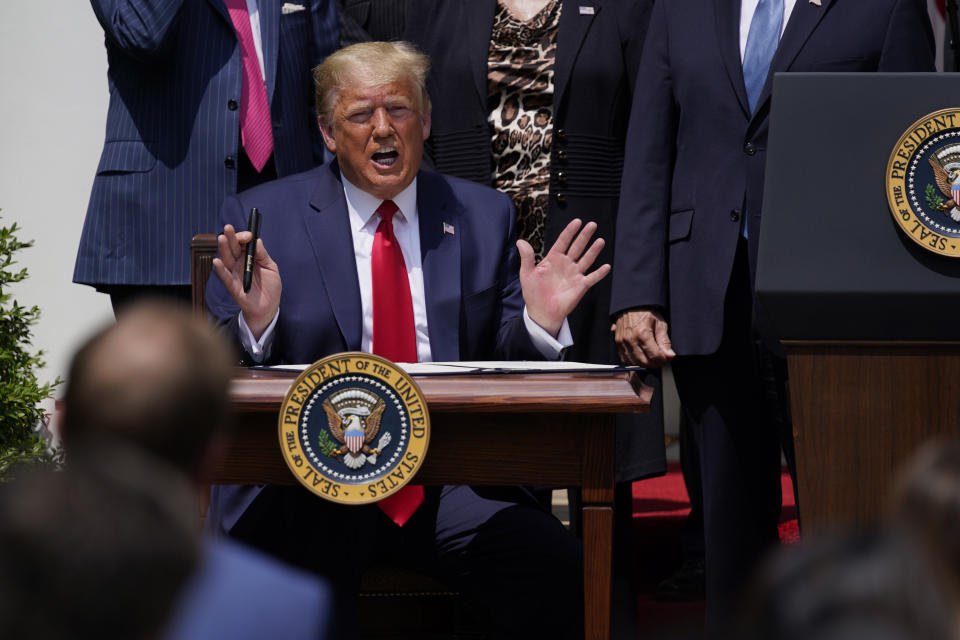 President Donald Trump speaks as he signs the Paycheck Protection Program Flexibility Act during a news conference in the Rose Garden of the White House, Friday, June 5, 2020, in Washington. (AP Photo/Evan Vucci)