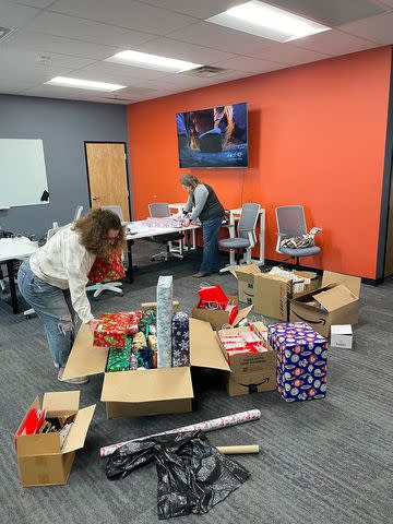 <p>courtesy cheri guy</p> Jill Houser and Jenny Meehan, both local MsGuy TikTok followers, volunteered to wrap packages