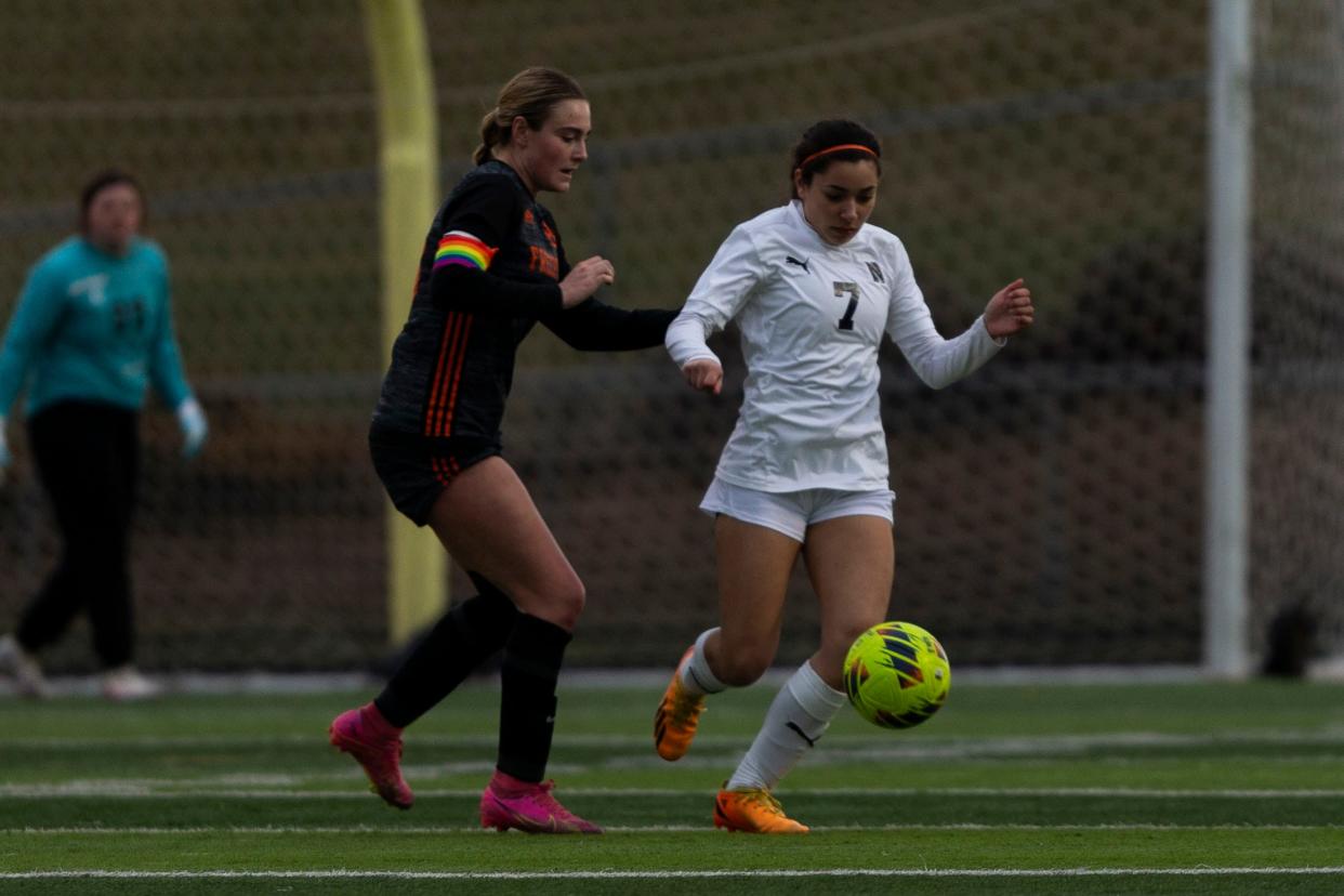 Belvidere North's Vera Sida (7) dribbles the ball while being guarded by Freeport's Autumn Diduch (13) during a game on Thursday, March. 21, 2024, at Freeport High School.