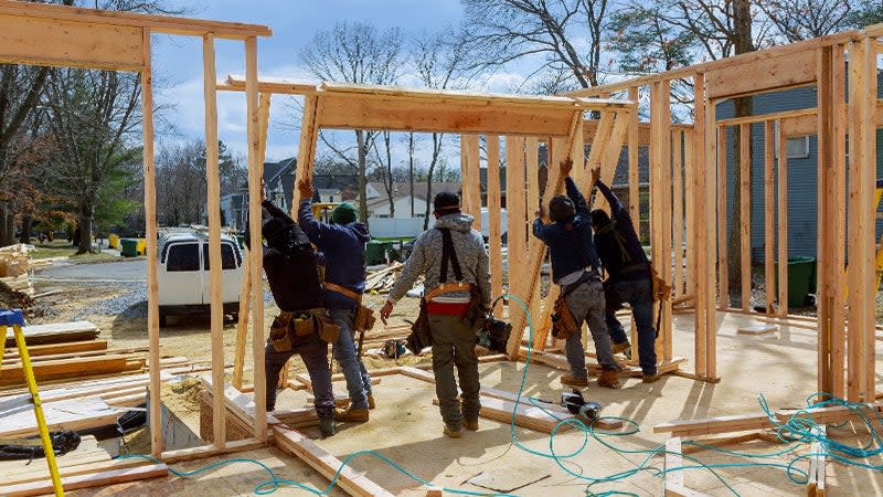 man building a house